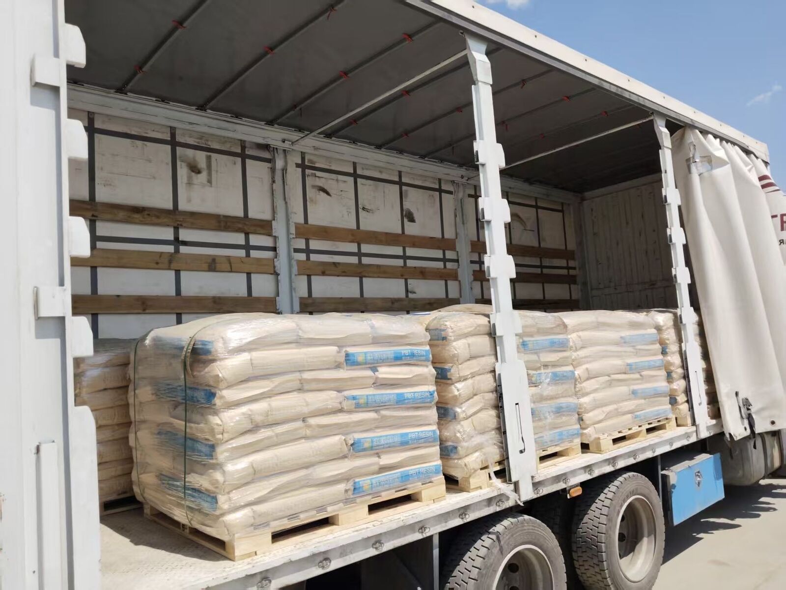 Strapped pallets loaded on a curtainsider trailer